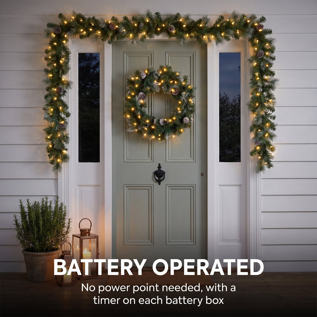 Christabelle Pre-Lit Bayville Pine Christmas Wreath 61cm or Garland 2.7m with 50 LED Lights, Pine Cones & Timer