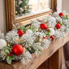 Christabelle 2.74m Snowy Elegance Christmas Garland Pre Lit Warm White LED Red Baubles Berries Flocked Mantel Banister